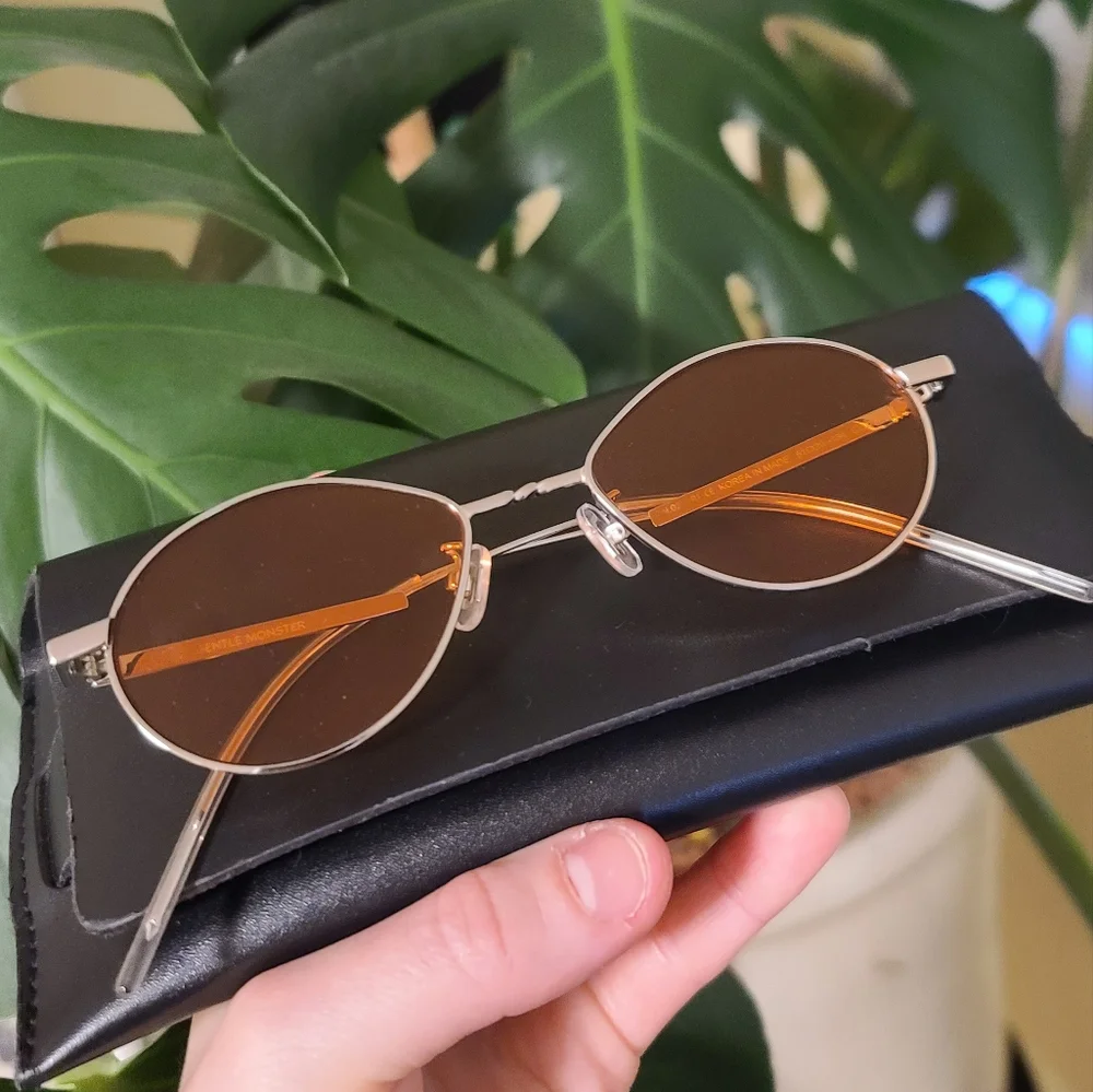 GENTLE MONSTER Oval Silver Frame Sunglasses with Orange Lenses